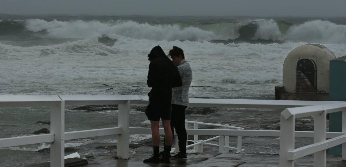 WILD WEATHER: Strong winds battered the the beaches as stormy conditions hung over the city. Picture: Simone De Peak