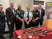 KEEPING GUNS OFF OUR STREETS: (L-R)Senior Constable Kerrin Sheedy, Minister for Police and Corrective Services and Minister for Fire and Emergency Services, Mark Ryan MP, Crime Stoppers Queensland Volunteer Liaison, Acting Superintendent Kylie Rigg, Ipswich Volunteer Crimestoppers committee chairperson, Scott Mawhinney, and Ipswich District Police Detective Inspector David Briese with weapons which have been surrendered.