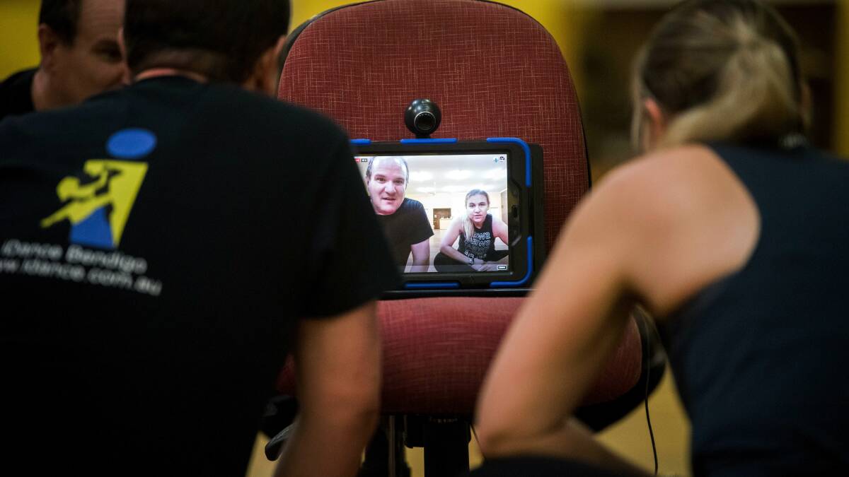 TEACHING TECH: Leah Borchard and Andrew White check in on their livestream. Picture: BRENDAN McCARTHY
