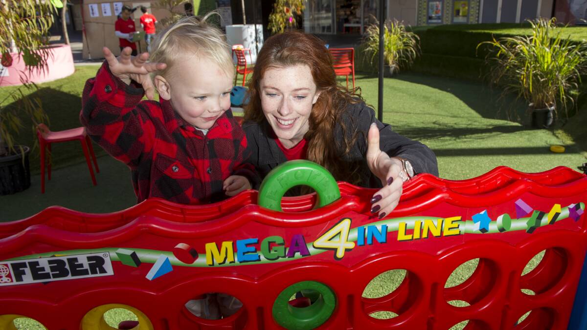FOOD FUN: LaTrobe University student Hattie Wedgewood engages with passers-by, including Ari Vale. Picture: DARREN HOWE