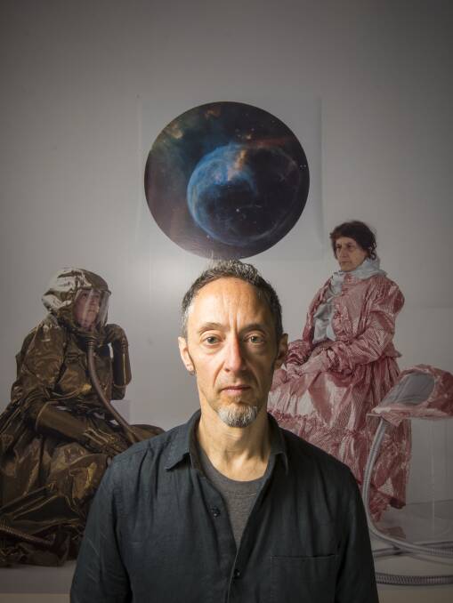 SPACE AGE: Castlemaine artist Andrew Goodman with his work 'untitled (afternoon Tea 2188)', a re-imagination of a 1888 oil by Emma Minnie Boyd. Picture: DARREN HOWE.