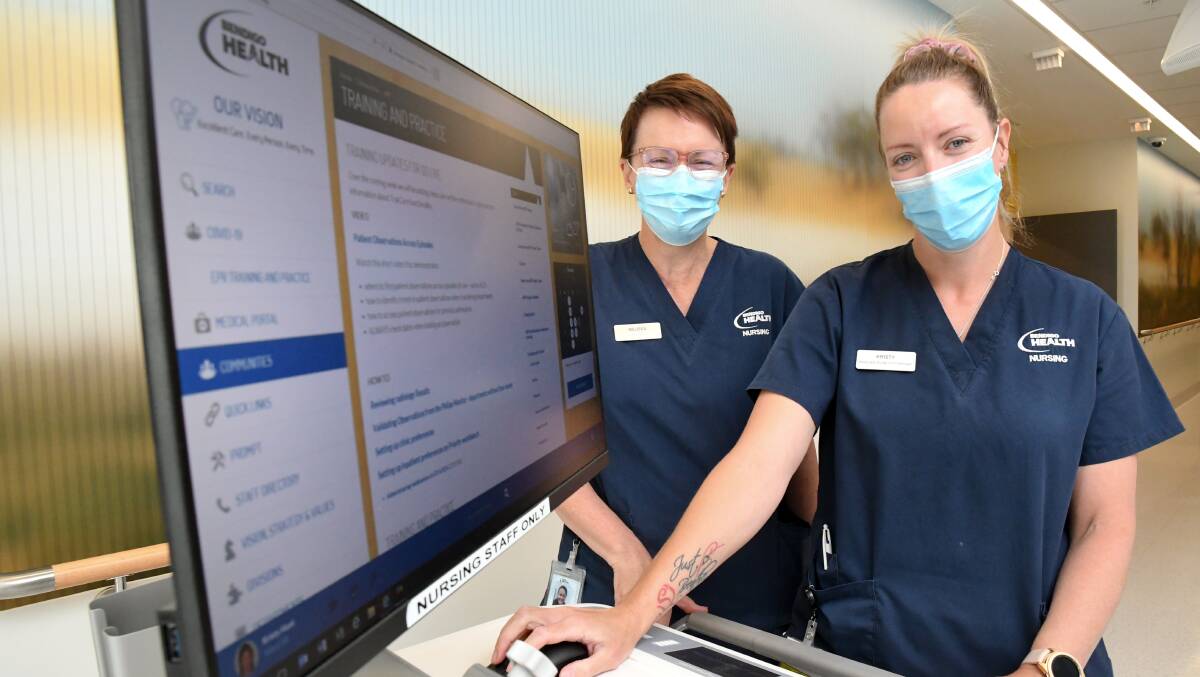READY TO GO: Bendigo Health staff members Melissa Ryan and Kirsty Hunt operate the new electronic patient record system. Picture: NONI HYETT
