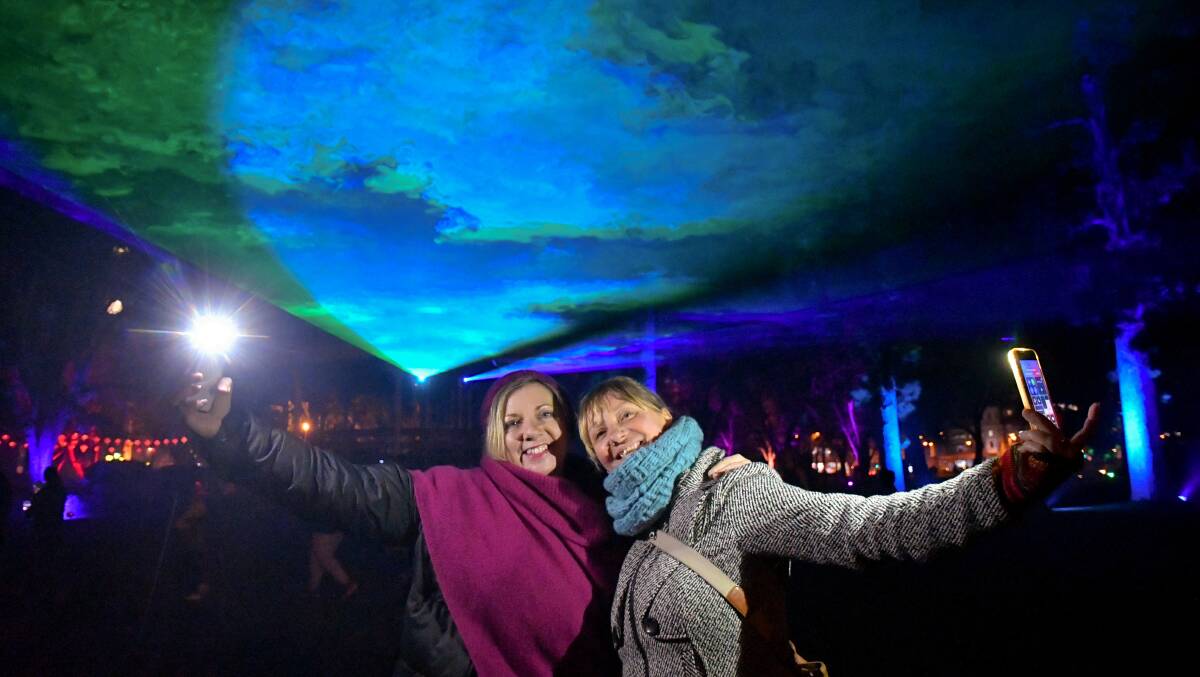 Fiona Curtain and Megan Stevens enjoy the Awaken festival. Picture: NONI HYETT