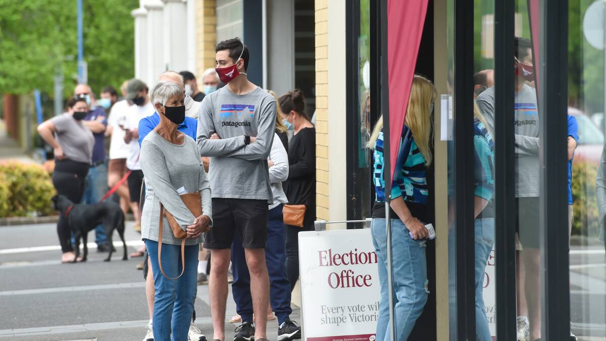 Voters at the Bendigo election office. Picture: DARREN HOWE