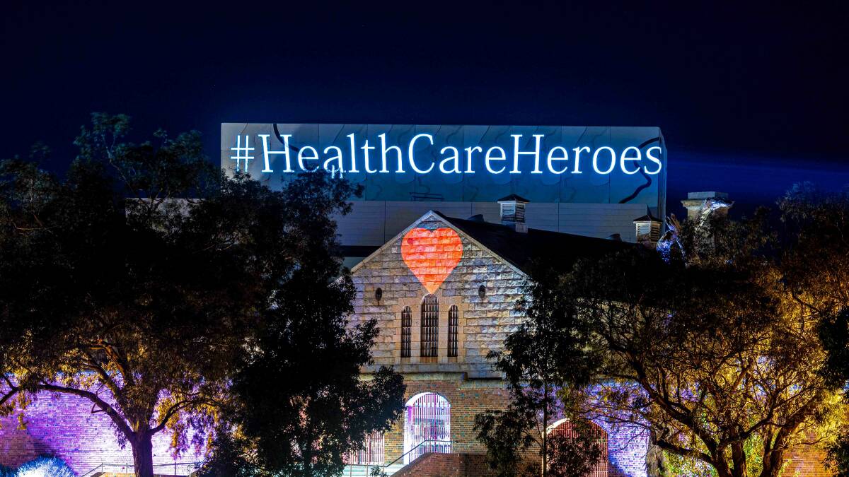 ILLUMINATED: Ullumbarra Theatre lit up to thank health care workers. Picture: AJ TAYLOR IMAGES