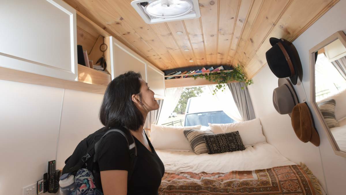 A tourist admires a tiny house at a 2019 Bendigo festival. Picture: NONI HYETT