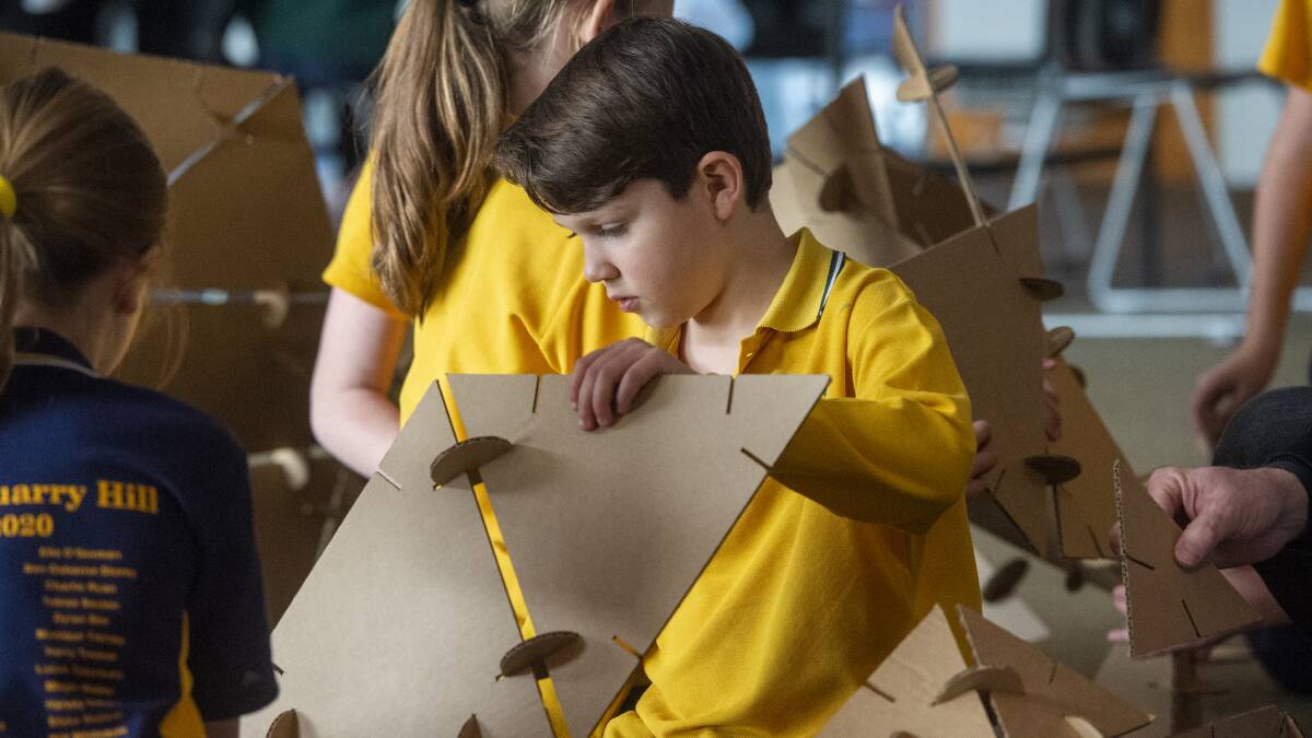 BUILDING BIG: A St Joseph's student works with the new Unboxy prototype, designed to help students back to the classroom. Picture: DARREN HOWE