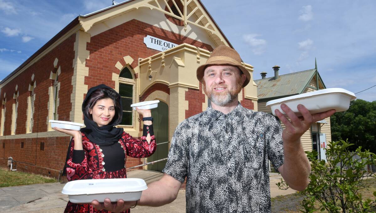 Laila Hashimi and Jason Newton show off Friday Food Safari meals, which will be part of the pop up Zinda Festival at the old Beehive building. Picture: NONI HYETT