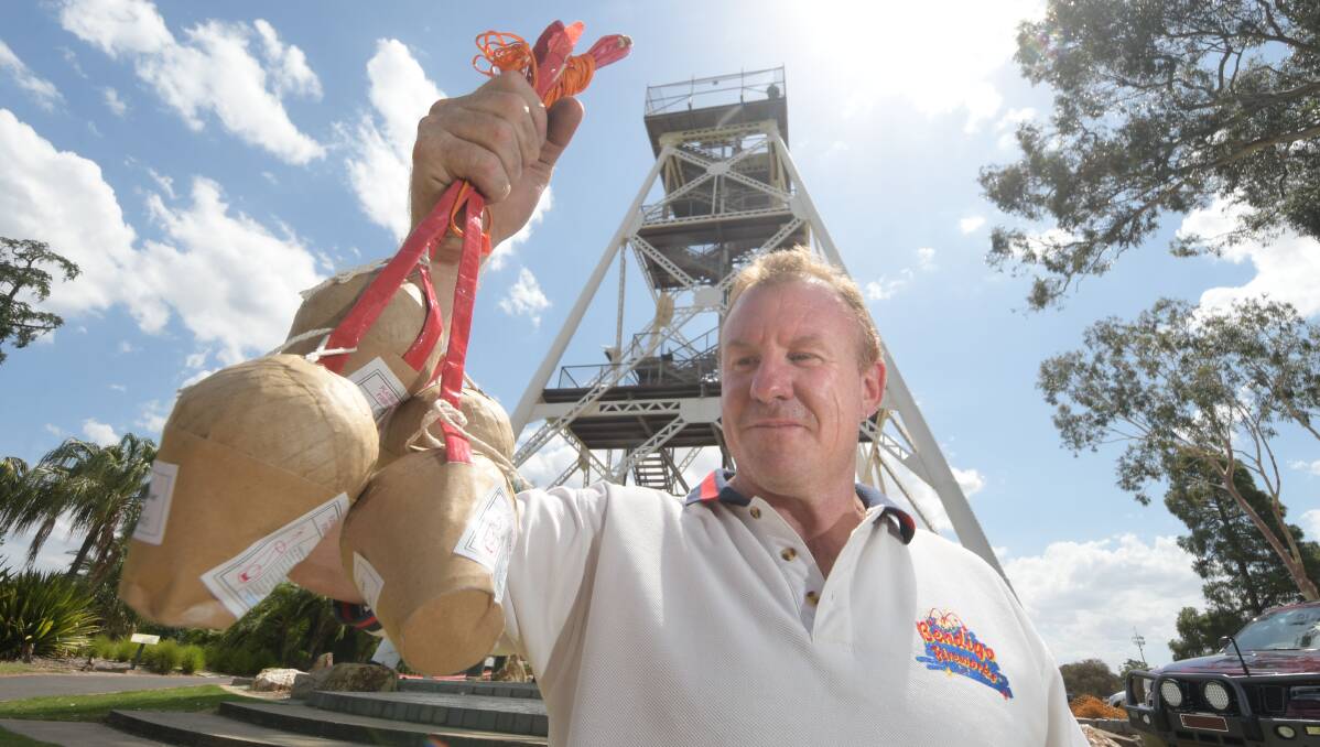 BOOM: Peter Daley prepares for Bendigo's New Year's Eve firework display in Rosalind Park. Picture: NONI HYETT.