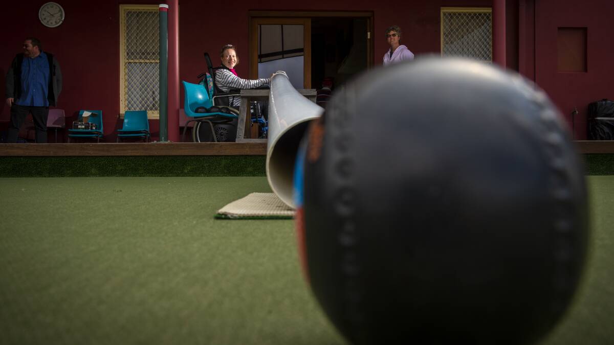 BOWLED OVER: Deanne Larkins uses a cannon to make a play on the green at the Eaglehawk Bowling Club. Picture: DARREN HOWE