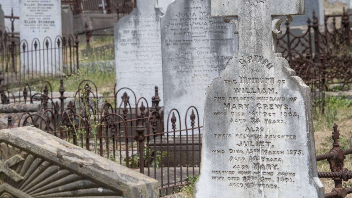 GRIEF: Lecturer David Waldron says many people on the goldfields adopted Spiritualism to try to connect with their deceased loved ones. These Castlemaine graves date from the gold rush era. Picture: DARREN HOWE.