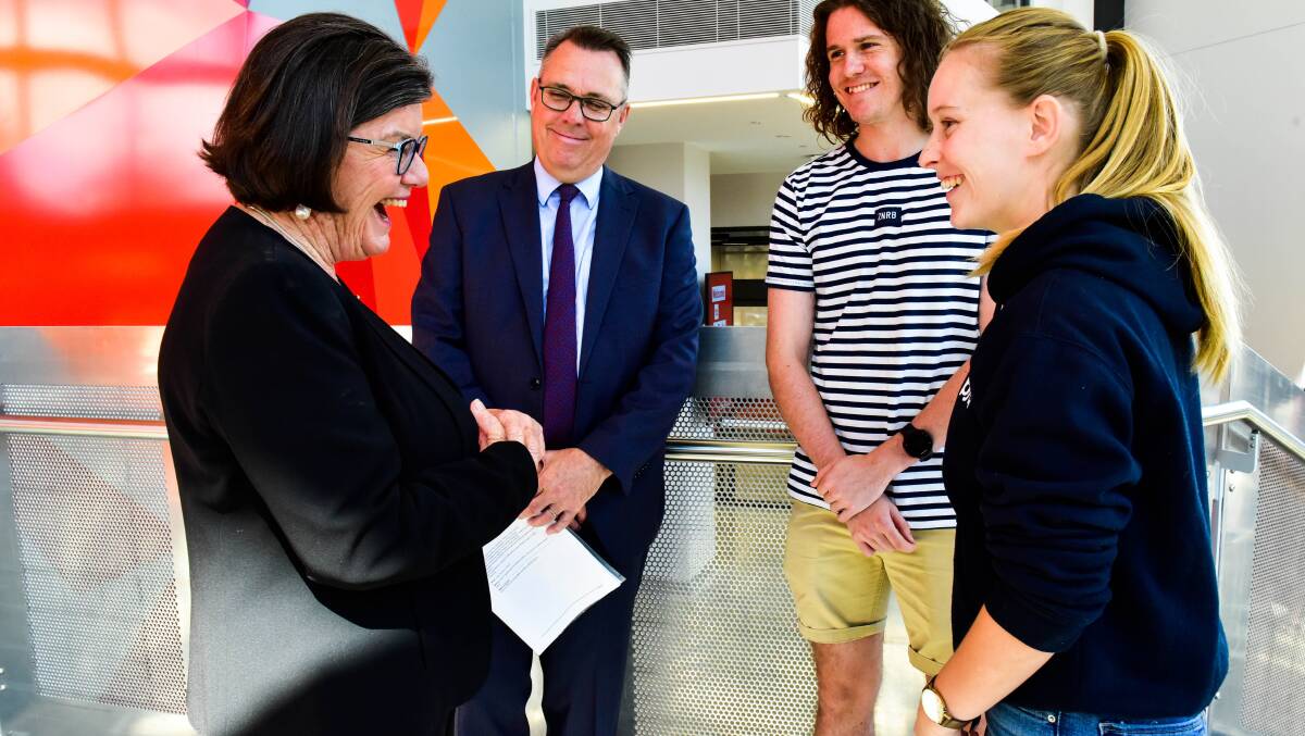 Cathy McGowan speaks with Vice Chancellor John Dewar and students Joe Kenny and Madeline Beckwith. Picture: BRENDAN McCARTHY