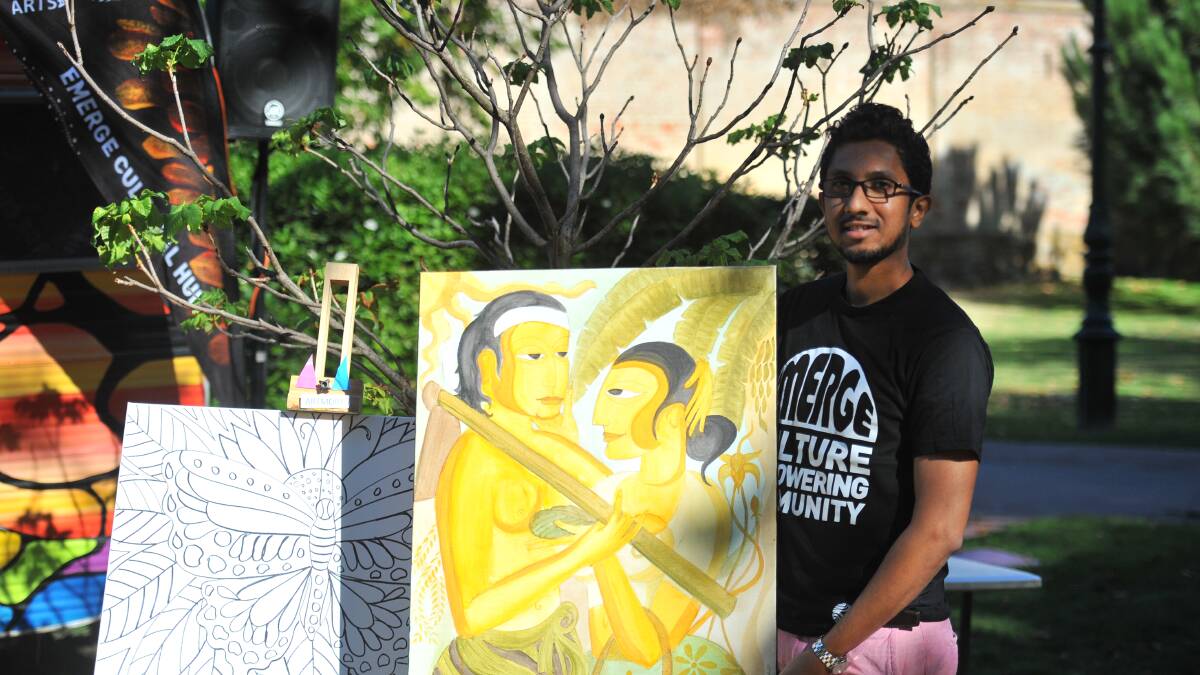 Akhila Fernando holds up an artwork at the Multicultural Hub. Picture: ELSPETH KERNEBONE