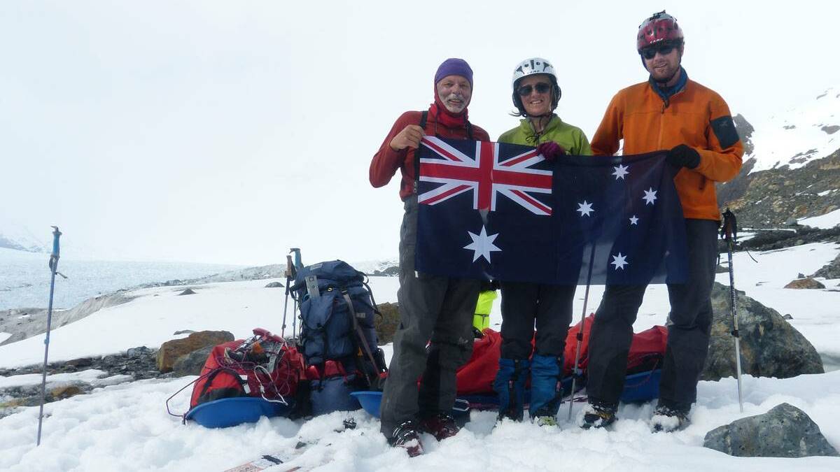 Linda Beilharz and her companions plant the Australian flag in Argentina. Picture: supplied
