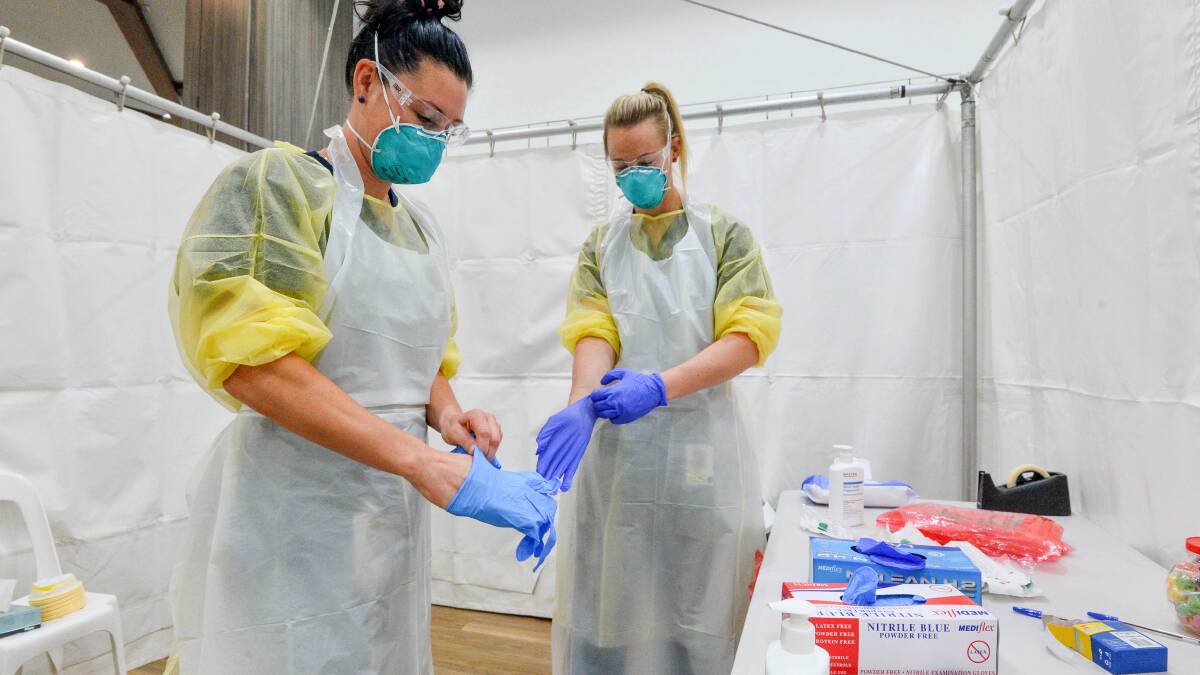 Nurses prepare to administer COVID-19 tests in 2020. Picture: BRENDAN McCARTHY