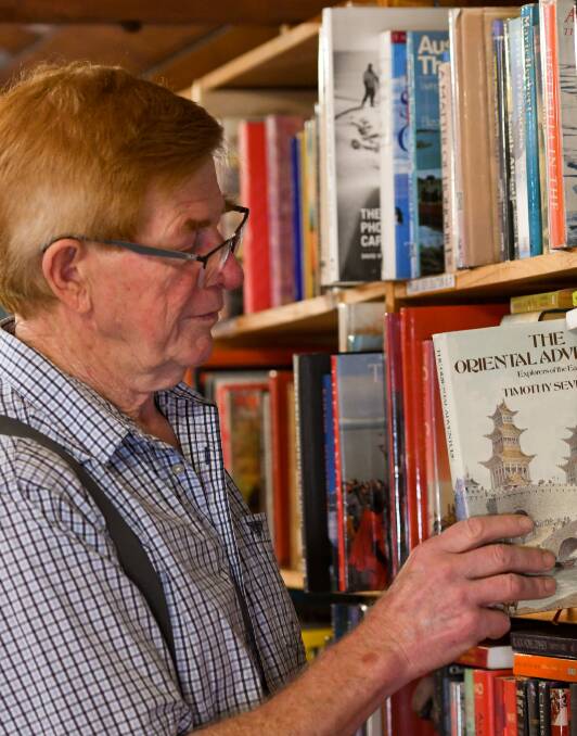 BOOK GAME: Garry Murray has sold second-hand books for 35 years. Picture: NONI HYETT