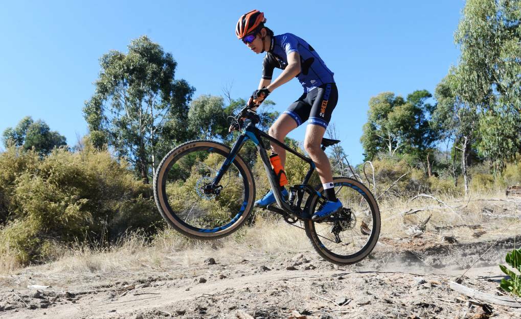 A mountain biker takes to the trail as it opens in Harcourt. Picture: DARREN HOWE