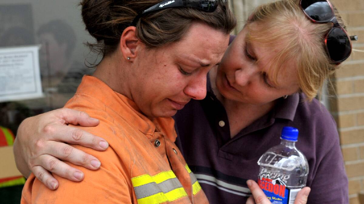 Sandra Richard who lost her house is comforted. Picture: BRENDAN MCCARTHY.