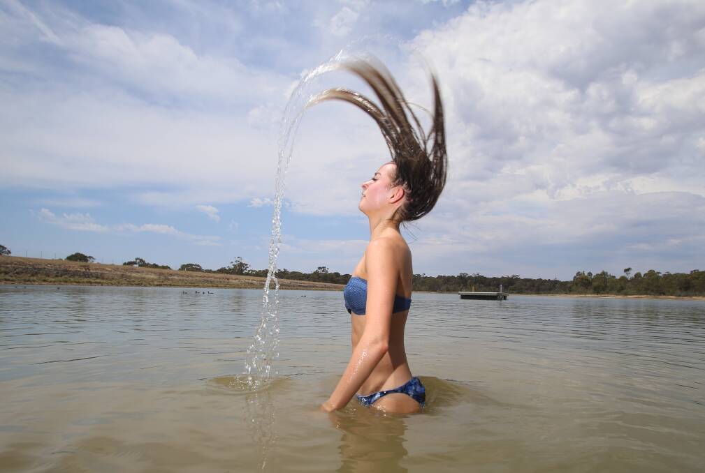 KEEPING COOL: Jarnae Peautagitama takes a plunge in Crusoe Reservoir during the heat. Picture: GLENN DANIELS.