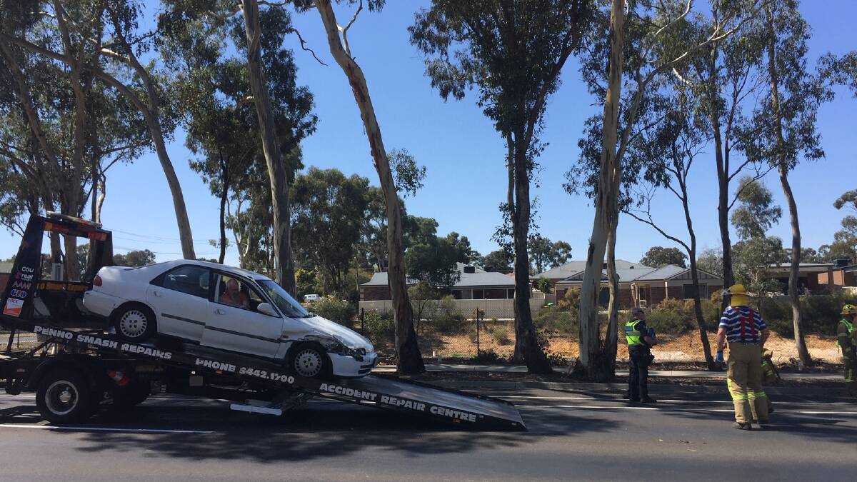 Woman freed from car after crash at Kangaroo Flat