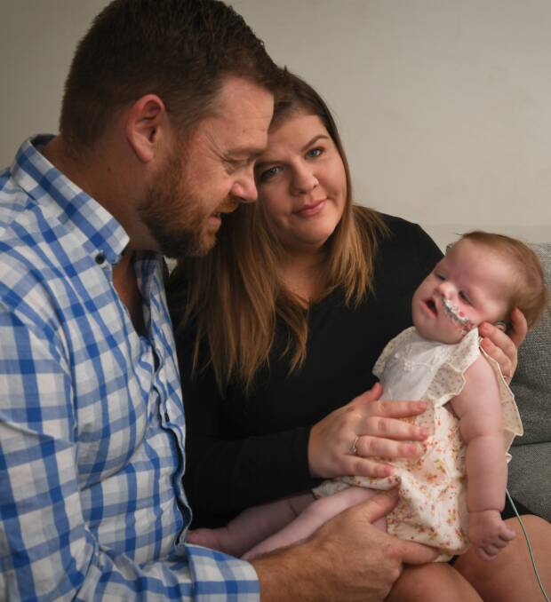 CHALLENGE: Joel and Molly Davis with their daughter Ally, the family struggled to access support for Ally's care after she was discharged from hospital in Melbourne. Picture: NONI HYETT