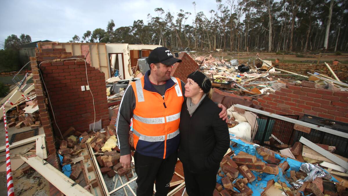 Wayne and Rachel Eve on the site of their home after it was destroyed by a tornado. Picture: GLENN DANIELS