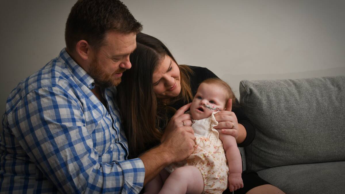 Joel and Molly Davis with their daughter Ally. Picture: NONI HYETT
