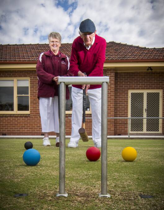 Maureen and Bill Wallace have taken up croquet, and love it so much they play as often as four times a week. Picture: DARREN HOWE.