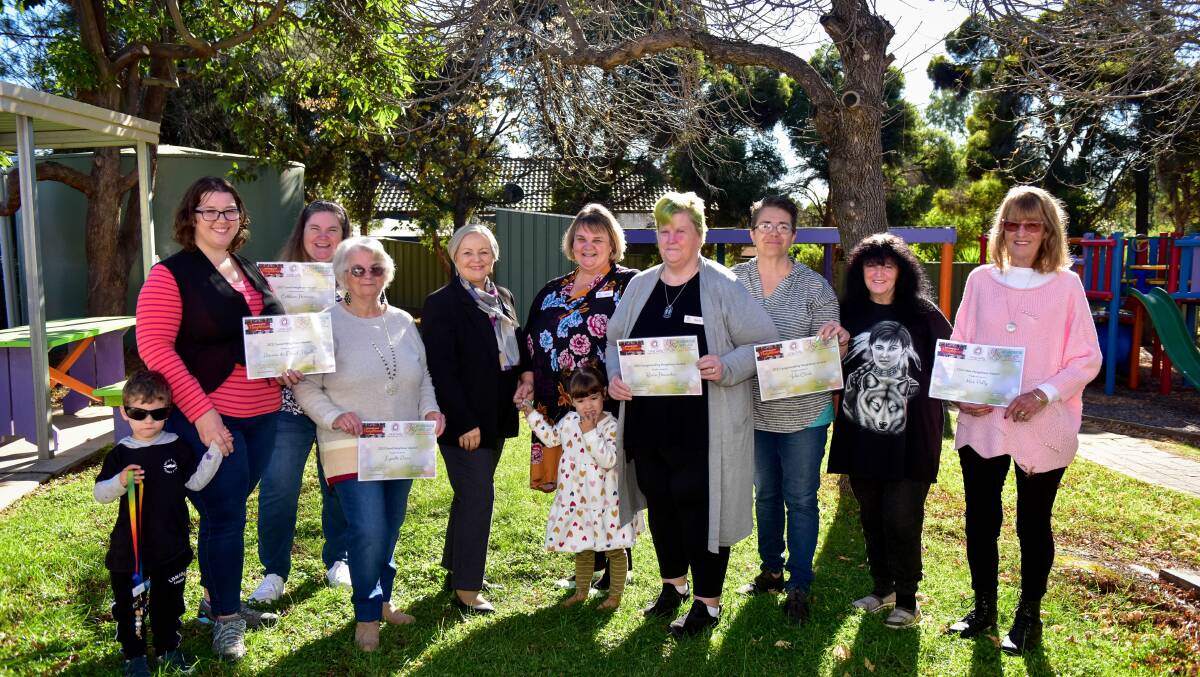 Sarah Bremner with Andrew, Cathleen Hemmes, Lynette Dunn, Jennifer Alden, Kerry Parry with Charlotte, Karin Haevecker, Julie Clark, Sharon Haigh and Polly Kane with their awards. Picture: BRENDAN McCARTHY