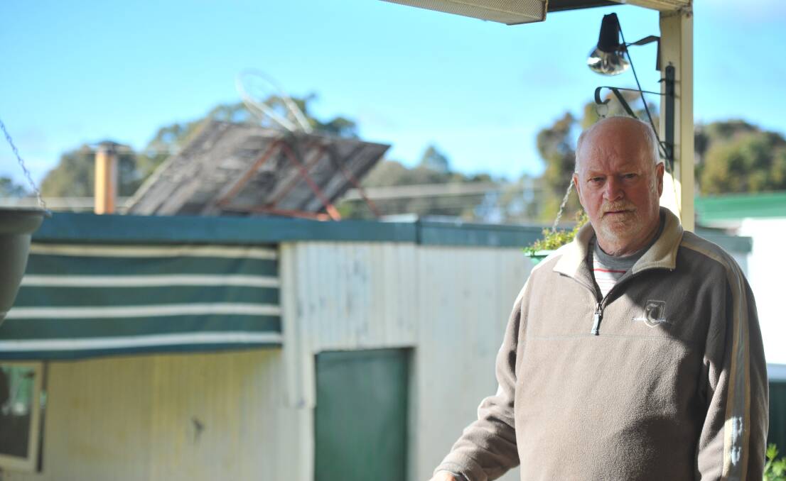 Robert Campbell with his damaged basketball hoop. Picture: ELSPETH KERNEBONE