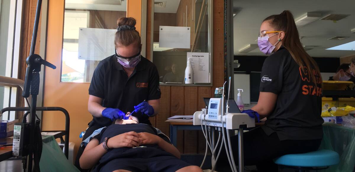 SMILE CARE: A White Hills student receives dental care from a Smile Squad. Picture: ELSPETH KERNEBONE
