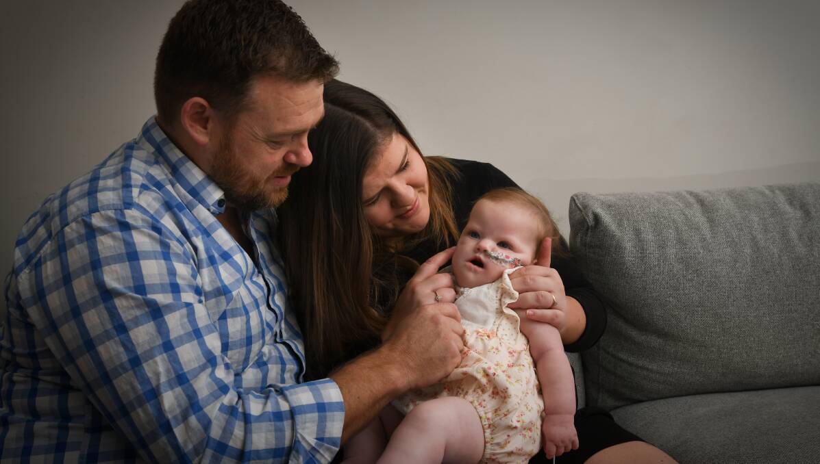 Joel and Molly Davis with their daughter Ally. Picture: NONI HYETT