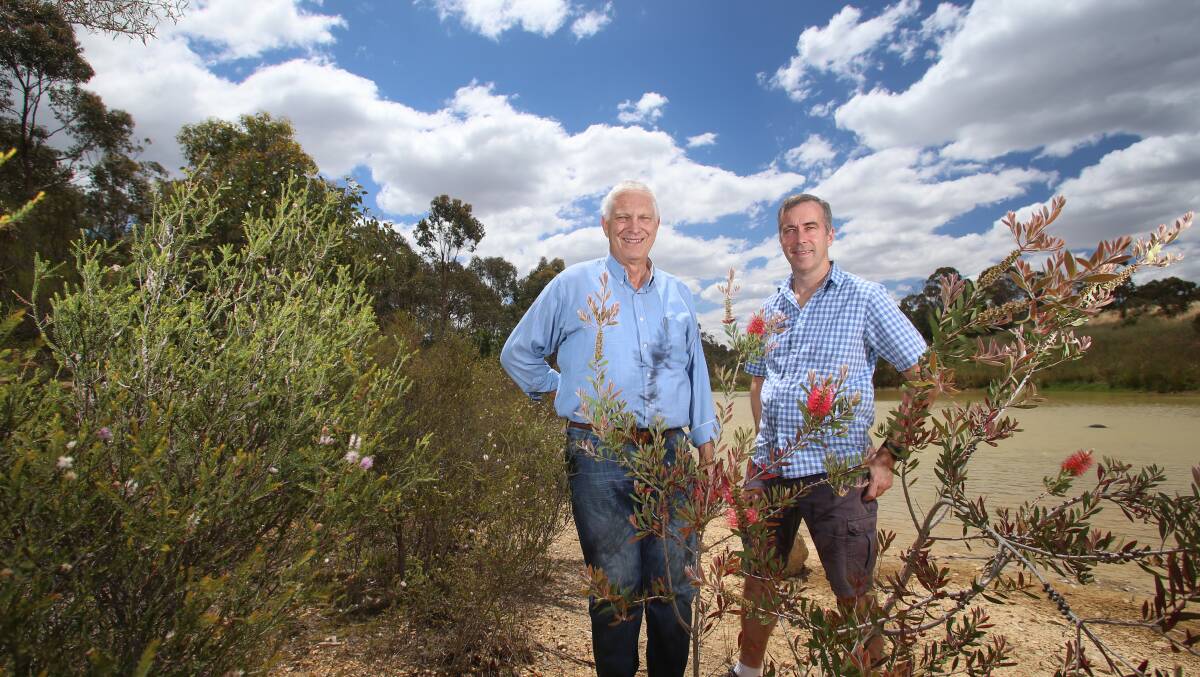 Junortoun Community Action Group members Kevin de Vries and Colin Smith in the suburb's woodland. Picture: GLENN DANIELS.