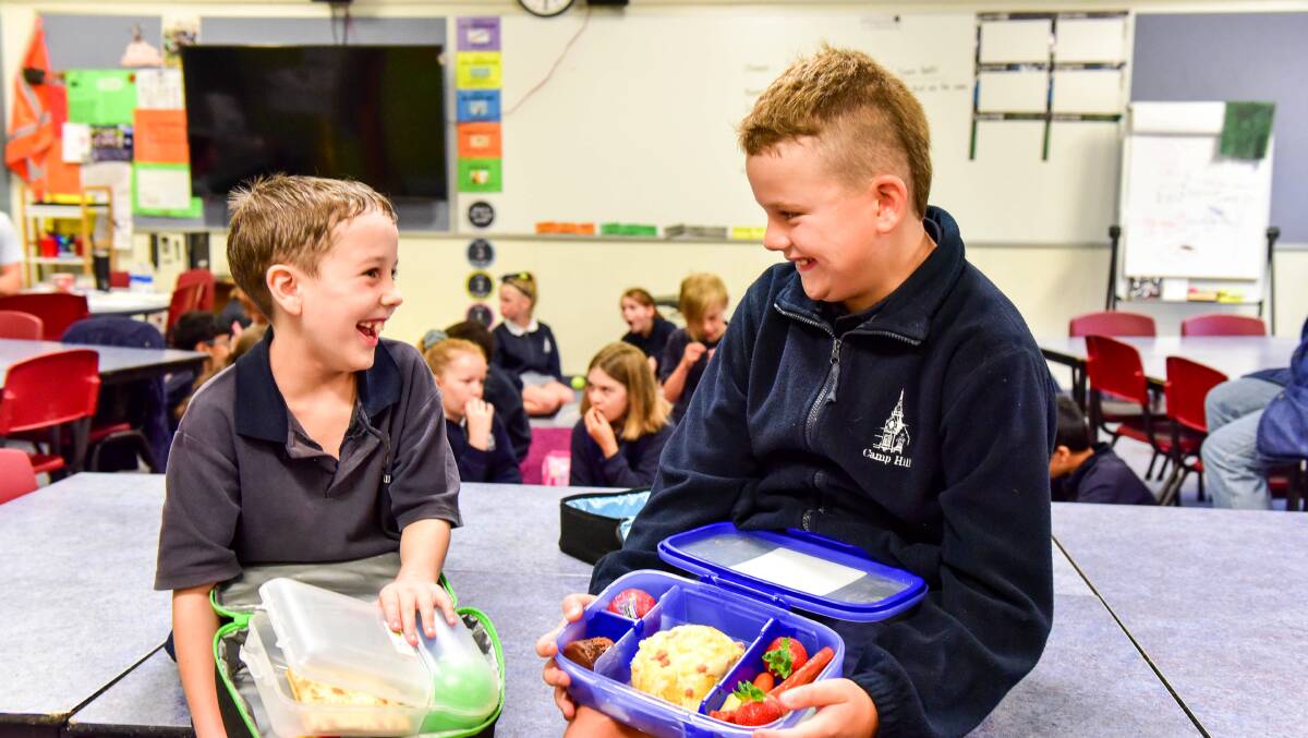 PLANET FRIENDLY: Kyah Weeks and Jarod Dole from Camp Hill Primary with their nude food lunch boxes, part of the school's sustainability programs. Picture: BRENDAN McCARTHY