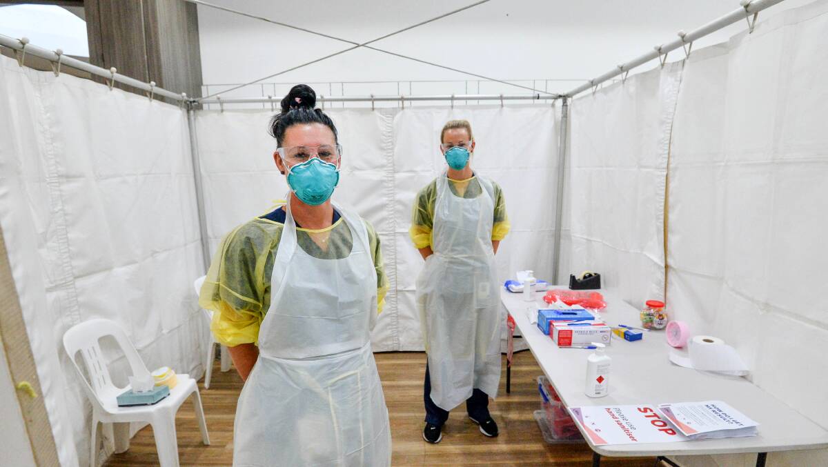 Staff at a pop up coronavirus clinic at Bendigo Marketplace. Picture: BRENDAN McCARTHY