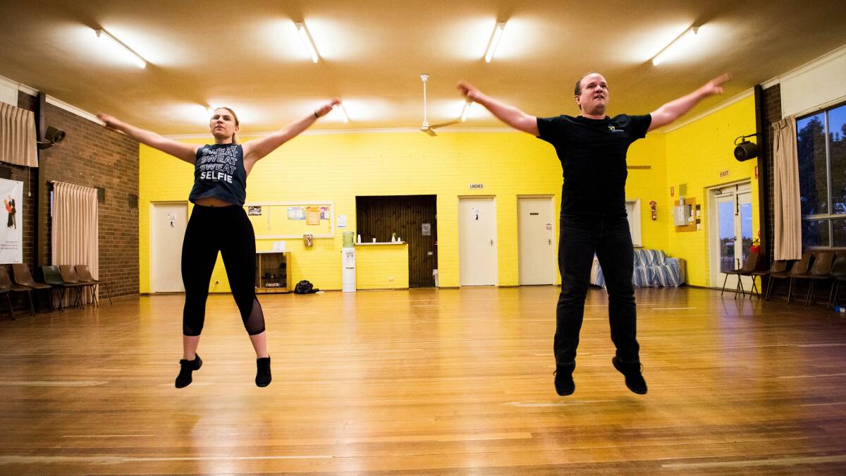 REACHING HIGH: Dance instructors Leah Borchard and Andrew White teach a class online. Picture: BRENDAN McCARTHY