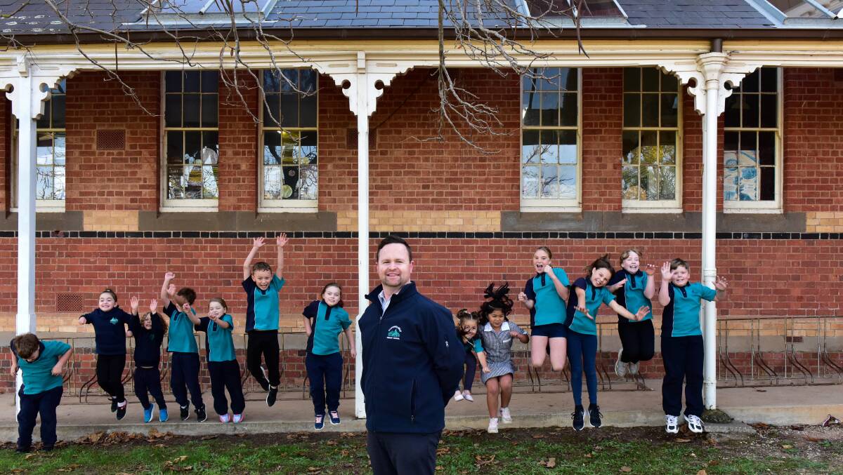 California Gully Primary School students celebrate with principal Andrew Frawley. Picture: BRENDAN McCARTHY