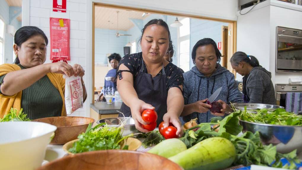 Participants at Loddon Campaspe Multicultural Services Friday Food Safari prepare a meal. Picture: DARREN HOWE