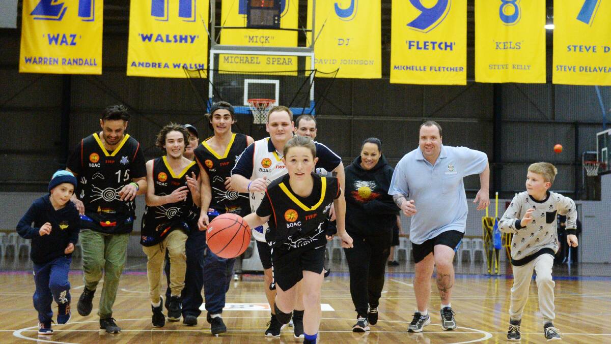 NAIDOC: Oscar Guilmartin leads the pack heading to the basket. Picture: DARREN HOWE