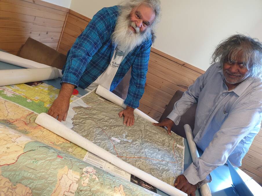  Senior Jaithmathang elders Roderick McLeod and Goengallajumma Bazil McLeod look over maps of Falls Creek at Howmans Gap Alpine Centre. Camp manager Michael Jowett said it was a privilege to witness.