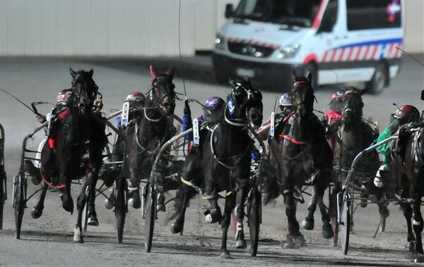 SPRINT HOME: Loving Life Lombo, centre, works to the lead in the 3YO fillies Breeders Crown heat at Lord’s Raceway last night.