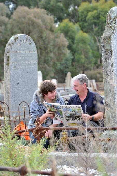 great legacy: Graeme Sproul and his son Tom, 19, at the grave site of Robert Ross Haverfield.