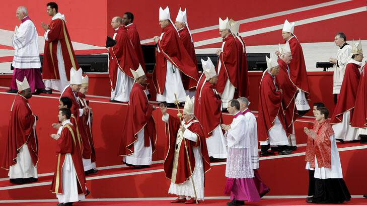 Pope Benedict XVI with Catholic clergy at World Youth Day in Sydney where he apologised for sex abuse by clergy.