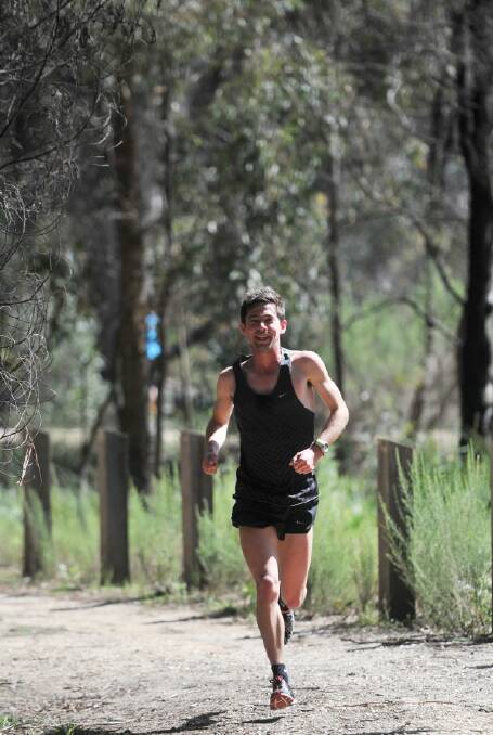 GOLDEN GLORY: Brady Threlfall wins the 5km in yesterday's Victorian Teachers' Games cross-country action at Crusoe Park near Kangaroo Flat. Picture: BRENDAN McCARTHY