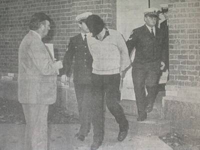 FLASHBACK: Freight company operator William Matthews is taken by police from Eaglehawk court house on June 19, 1986, after being charged with the murder of Kevin Pearce. The charges were later dropped.
