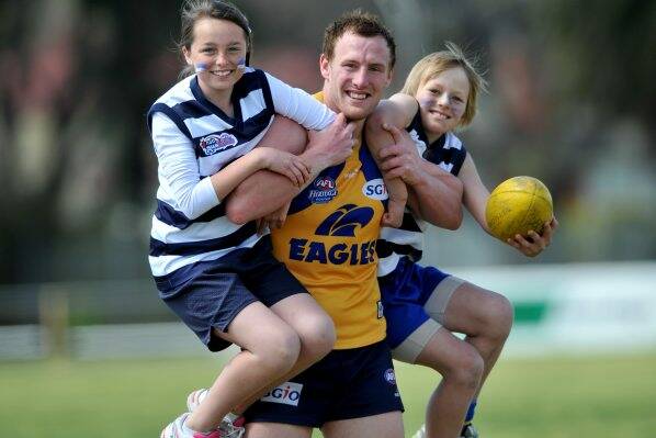 hold on: Stacy Fiske gives Kaitlyn Hall and Zane Keighran a lift. Picture: MATT KIMPTON