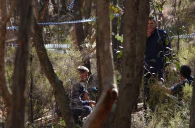UNRAVELLING: Forensic investigators search the site where the body was discovered on Crown land near Chewton.
