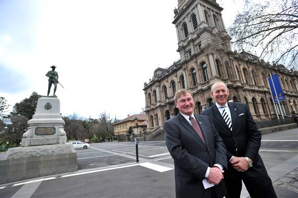 tribute: Mayor Cr Rod Campbell and Bendigo Myer store manager Colin Porter check out the site.