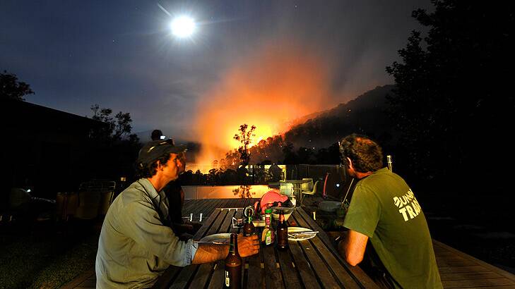 Incredible sight ... Justin Crawley watches the bushfire from his Harrietville property.