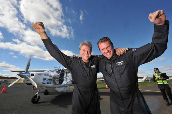 SKY’S THE LIMIT: Tim Pryse and Ken Evers before takeoff.